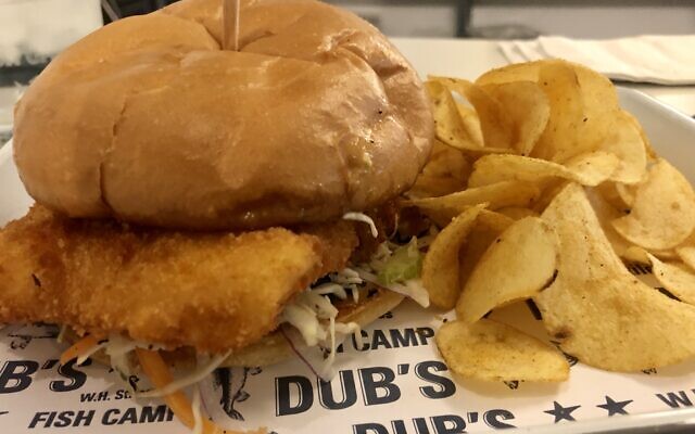 Crispy “Today’s Catch” Sandwich: Cod served with apple cider vinegar remoulade, pickles and onions on a roll.