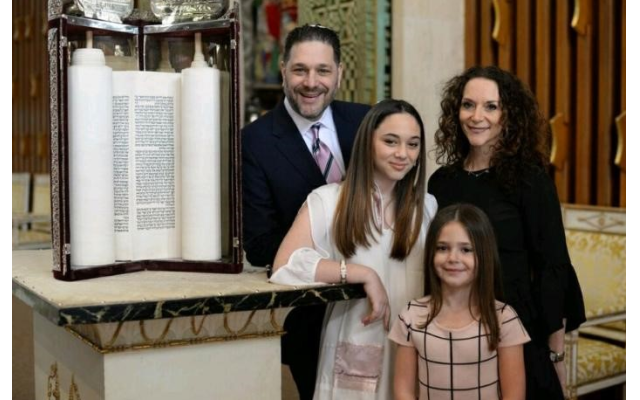 Photos by Zach Porter, Revelry Photo House// Lori and Rick Harber with bat mitzvah Laila at AA Synagogue. In front is sister Sofia.