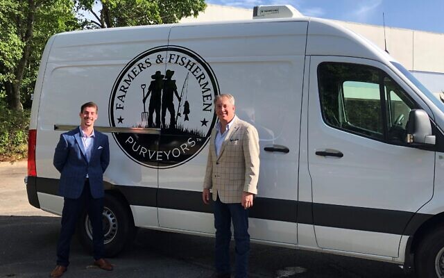 Kirk Halpern, founder and CEO, right, with son Ben prepare to deliver fresh fish and meats.
