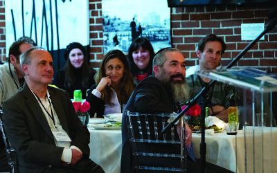 Rabbi Schusterman, front right, and other professionals enjoy a Jewish Business Network event.