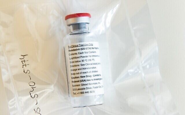 In this photo one vial of the drug Remdesivir is viewed during a press conference about the start of a study with the Ebola drug Remdesivir in particularly severely ill patients at the University Hospital Eppendorf (UKE) in Hamburg, northern Germany on April 8, 2020, amidst the new coronavirus COVID-19 pandemic. - Gilead Science's remdesivir, one of the most highly anticipated drugs being tested against the new coronavirus, showed positive results in a large-scale US government trial, the company said on April 29, 2020."We understand that the trial has met its primary endpoint and that NIAID (National Institute of Allergy and Infectious Diseases) will provide detailed information at an upcoming briefing," the company said. (Photo by Ulrich Perrey / POOL / AFP)