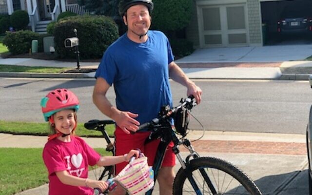 Dan Goldman bikes with daughter Amelia.