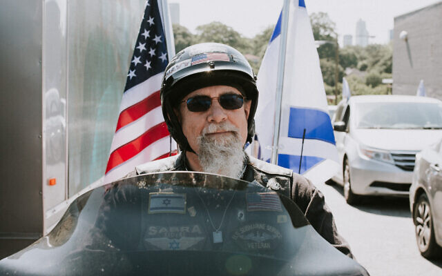 Photos by Shelbelle Lapidus //  Motorcyclist Wayne Markman was proud to fly both the American and Israeli flags.