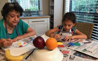 Before COVID-19, granddaughter Heidi enjoyed painting lesson with grandma.