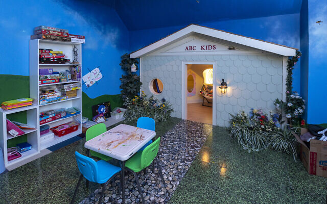 The children’s playroom is one of the three hidden areas in the home. The walls and ceiling were painted with clouds, stars and birds.