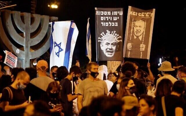 Israelis protest against Prime Minister Benjamin Netanyahu in Jerusalem, on July 21, 2020. (Photo by Ahmad GHARABLI / AFP)