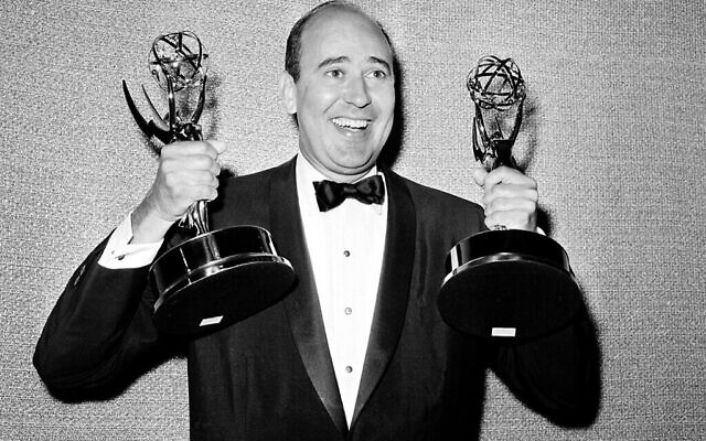 FILE - In this May 26, 1963 file photo, Carl Reiner shows holds two Emmy statuettes presented to him as best comedy writer for the "Dick Van Dyke Show," during the annual Emmy Awards presentation in Los Angeles. Reiner, the ingenious and versatile writer, actor and director who broke through as a “second banana” to Sid Caesar and rose to comedy’s front ranks as creator of “The Dick Van Dyke Show” and straight man to Mel Brooks’ “2000 Year Old Man,” has died, according to reports. Variety reported he died of natural causes on Monday night, June 29, 2020, at his home in Beverly Hills, Calif. He was 98. (AP Photo, File)