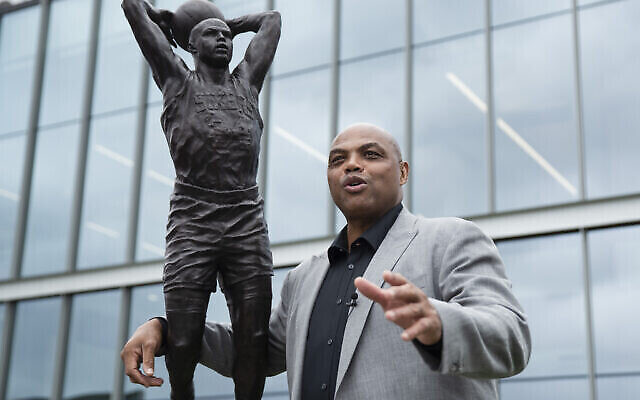 Charles Barkley poses for photographs with a sculpture honoring him at the Philadelphia 76ers NBA basketball training facility in Camden, N.J., Friday, Sept. 13, 2019. (AP Photo/Matt Rourke)