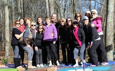 A few days before her brain biopsy in 2016, friends gave support to Karen Paz at a yoga session near the Chattahoochee River in Roswell.