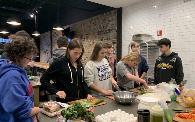 Weber Hebrew students prepare an Israeli breakfast after watching Unpacked videos about Israeli food and culture. The students gathered at the professional kitchen owned by Weber mom Cindy Stern, Yes, Chef! and prepared shakshuka, Israeli salad, hummus and other dips.