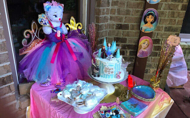 One of Habif’s dessert tables features an Elsa and Anna princess cake in shades of blue, decorated with characters from the movie “Frozen.”
