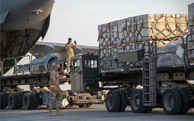 US Air Force personnel load humanitarian aid supplies onto a plane bound for Beirut, at Al Udeid Air Base, Qatar, August 6, 2020. (US Air Force/Staff Sgt. Heather Fejerang)