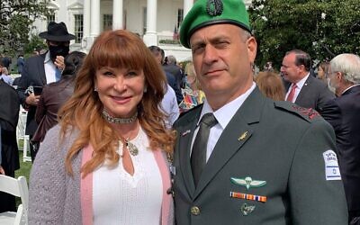 Evans poses with Brig. Gen. Yehudah Fox, defense attaché, in Washington after the White House ceremony.