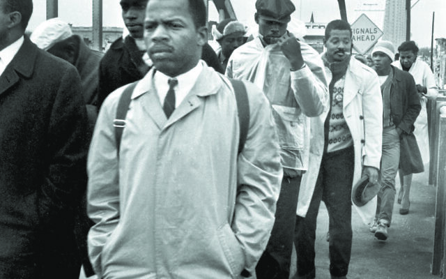 John Lewis nearly died on the Edmund Pettus Bridge in Selma, Ala., in 1965 marching for Black rights.