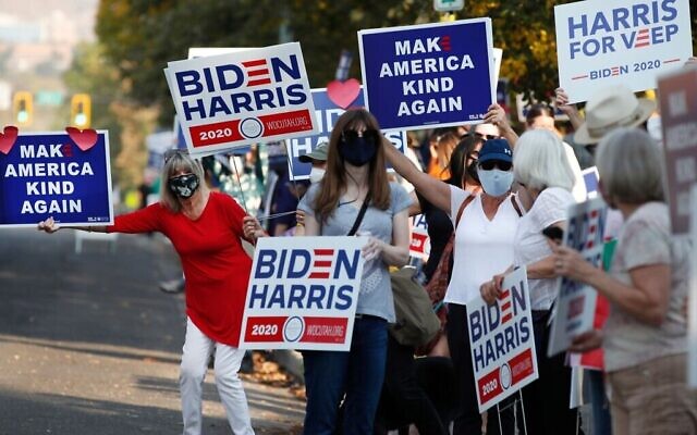Supporters of Democratic Presidential candidate and former US Vice President Joe Biden show their support before the vice presidential debate outside Kingsbury Hall at the University of Utah in Salt Lake City, Utah on October 7, 2020. (George Frey AFP via Getty Images/ via JTA)