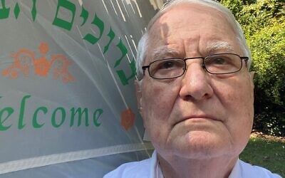 Yudelson takes a selfie in front of his sukkah.