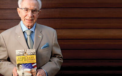 Ben Lesser with his book, “Living A Life That Matters.”