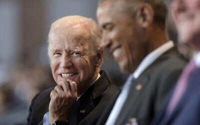 In this Jan. 4, 2017 file photo, Vice President Joe Biden, left, watches President Barack Obama, center, at Conmy Hall, Joint Base Myer-Henderson Hall, Va. (AP Photo/Susan Walsh)
