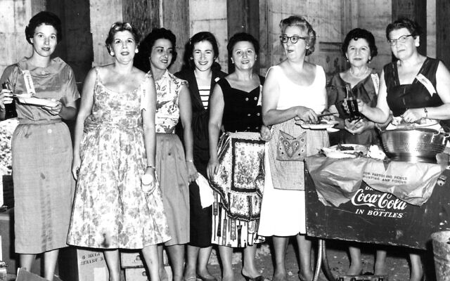 Courtesy of The Breman Museum archives/Jeremy Katz // Sisterhood members line up to serve lunch to members who had come to see their new shul on Peachtree Battle Avenue, summer 1958.