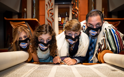 Scensations Photography // Jacob Levin’s bar mitzvah was postponed from March to October as a result of the pandemic. Here he poses with his family showing off their personalized masks.