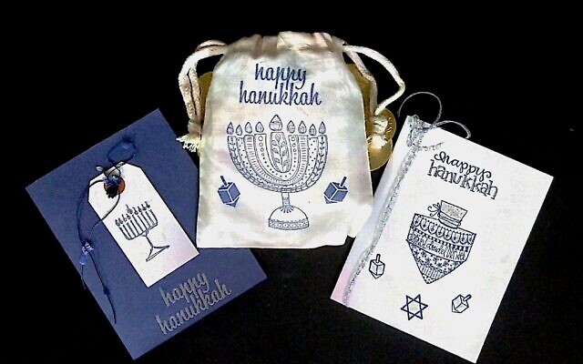 Using rubber stamps and colorful inks, Debbie Taratoot captures the joy of Chanukah in her greeting card and gift bag designs.