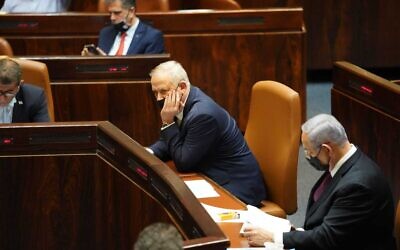 Benny Gantz, left, and Benjamin Netanyahu in the Knesset during a vote for the parliament to dissolve itself, on December 2, 2020. (Danny Shem Tov/ Knesset Spokesperson)