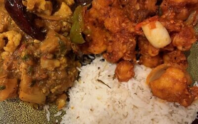 Aloo Gobi, left, had dried red peppers, cauliflower and potatoes in a tomato base. Bang Bang Gobi, right, was deeply coated fried vegetables in a sweet chili sauce.