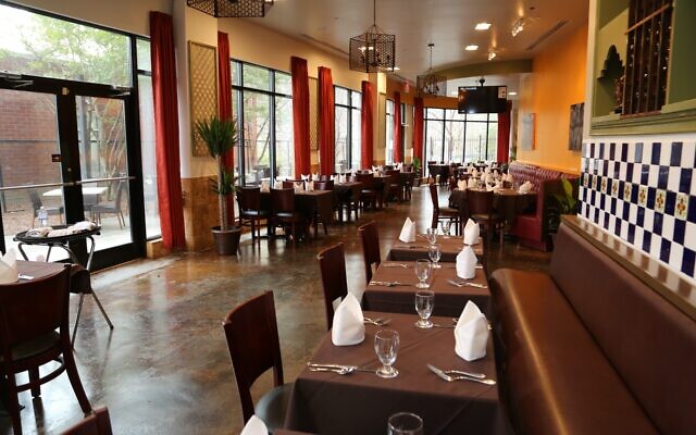 Inspired high ceilings and windows draped in tangerine have upscale vibes not usually associated with casual Indian food.