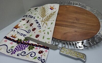 The challah board and knife, along with an applique challah cloth, make a meaningful wedding gift to last a lifetime, available at Judaica Corner.