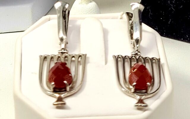 Tal Moran, jewelry designer at Aimee Jewelry created one-of-a-kind menorah earrings using two red carnelian stones.