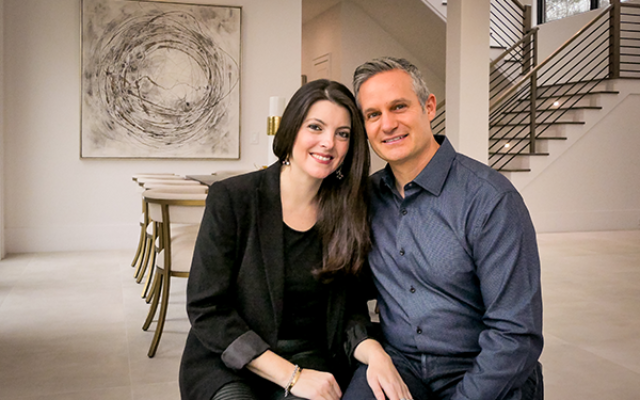 Photography by Duane Stork // Narissa and Dan Bonnet were hands on in engineering a well thought out 8,200-square-foot three-level contemporary house in Sandy Springs. The couple is seen here in the dining room.