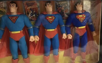 Items from Robkin's valuable collection of Superman from the '40s, '70s and '90s accompanied by comic books.