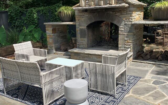 A stone firepit welcomes s’mores-making and small gatherings at Lisa and Zach Lazarus’ home.