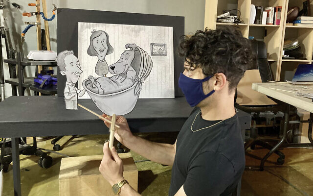Jake Krakovsky manipulates puppets made by Ryan Bradburn.
