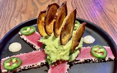 Tuna tartar is bold and bright with jalapeños and guacamole.