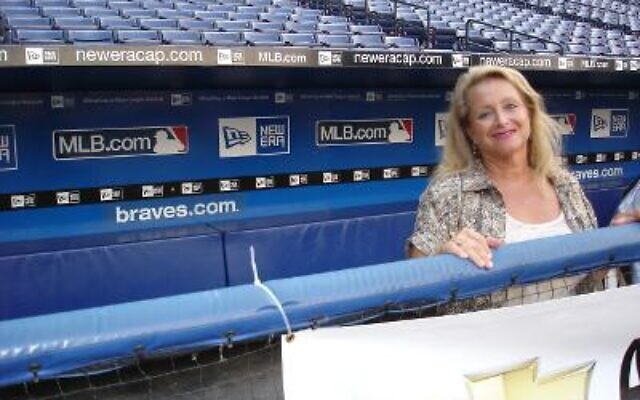 Then and now: Marlene Colon in the Braves dugout. A special tribute to Colon was shown at a recent Braves game.