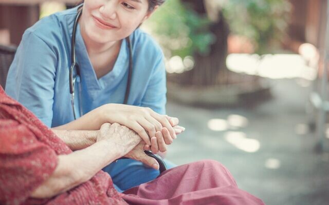 Chompoo Suriyo/Shutterstock // 
Elderly woman with her caregiver at home.