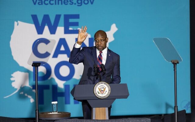 Nathan Posner for the AJT// Sen. Raphael Warnock (D-GA) speaks at a "We Can Do This" vaccine tour event with Vice President Kamala Harris in Atlanta June 18.