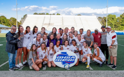 The varsity soccer team of Johns Creek High School is seen after winning the 6A championship.
