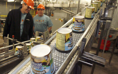 Ice cream moves along the production line at Ben & Jerry's Homemade Ice Cream, in Waterbury, Vermont. on March 23, 2010. (AP Photo/Toby Talbot/File)