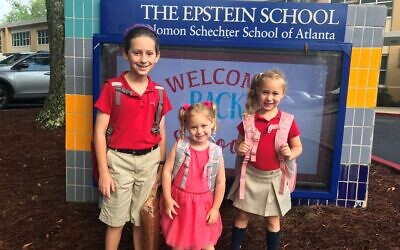 Epstein School students Micah, Ryleigh Reese, and Alexis Bank go back to school.