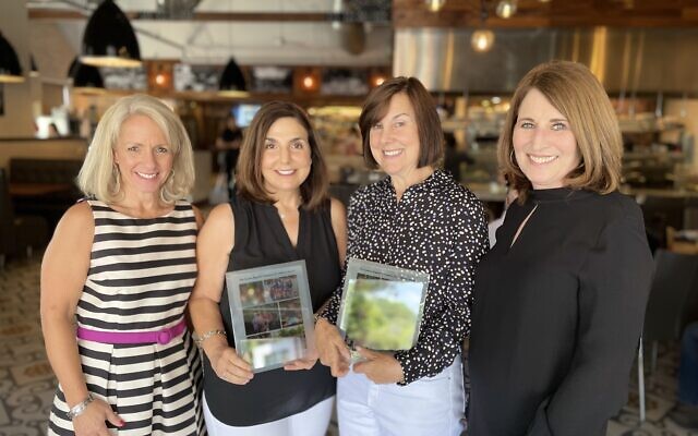 Kristin Connor, CEO of CURE, with Cindy Goldberg, Debbie Levinson and Janis Zagoria.