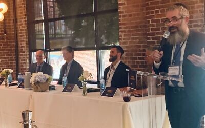 Panelists A.J. Robinson, Nick Imerman, Nat Kaplan and Norman Radow applauded Rabbi Eliyahu Schusterman’s success in real estate ventures.