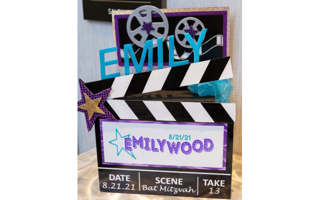 Photos by Revelry Photo House// Centerpieces celebrate Emily’s love of all things Hollywood.