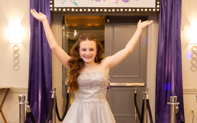 Photos by Revelry Photo House// Emily poses in front of her entrance to “Emilywood.”
