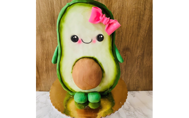 Funfetti cake carved and covered in fondant to look like an adorable avocado for a 2nd birthday party.