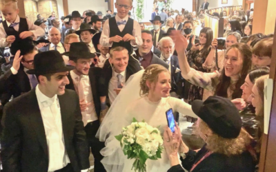 Photos by Joel Alpert/ Market Power // Guests rush up to sing and dance as they accompany newlyweds from the chuppah.