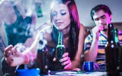Teens drinking and smoking at a crazy party.