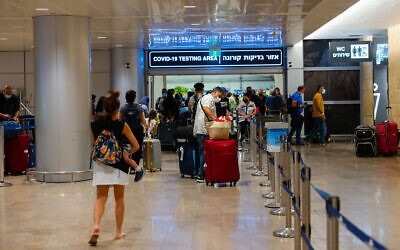 Travelers arriving at the Ben Gurion International Airport in Israel, stand in line to get a Covid19 check upon arrival. July 01, 2021. Photo by Nati Shohat/FLASH90
