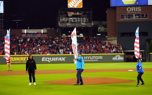 Ken and Jeannette Flores-Katz were selected to throw the first pitch at Game 3 of the World Series.